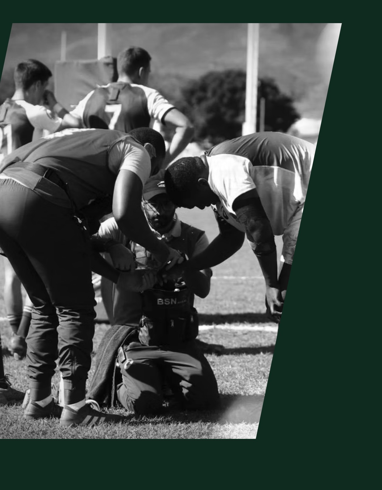 Medical staff attending to an athlete pitchside